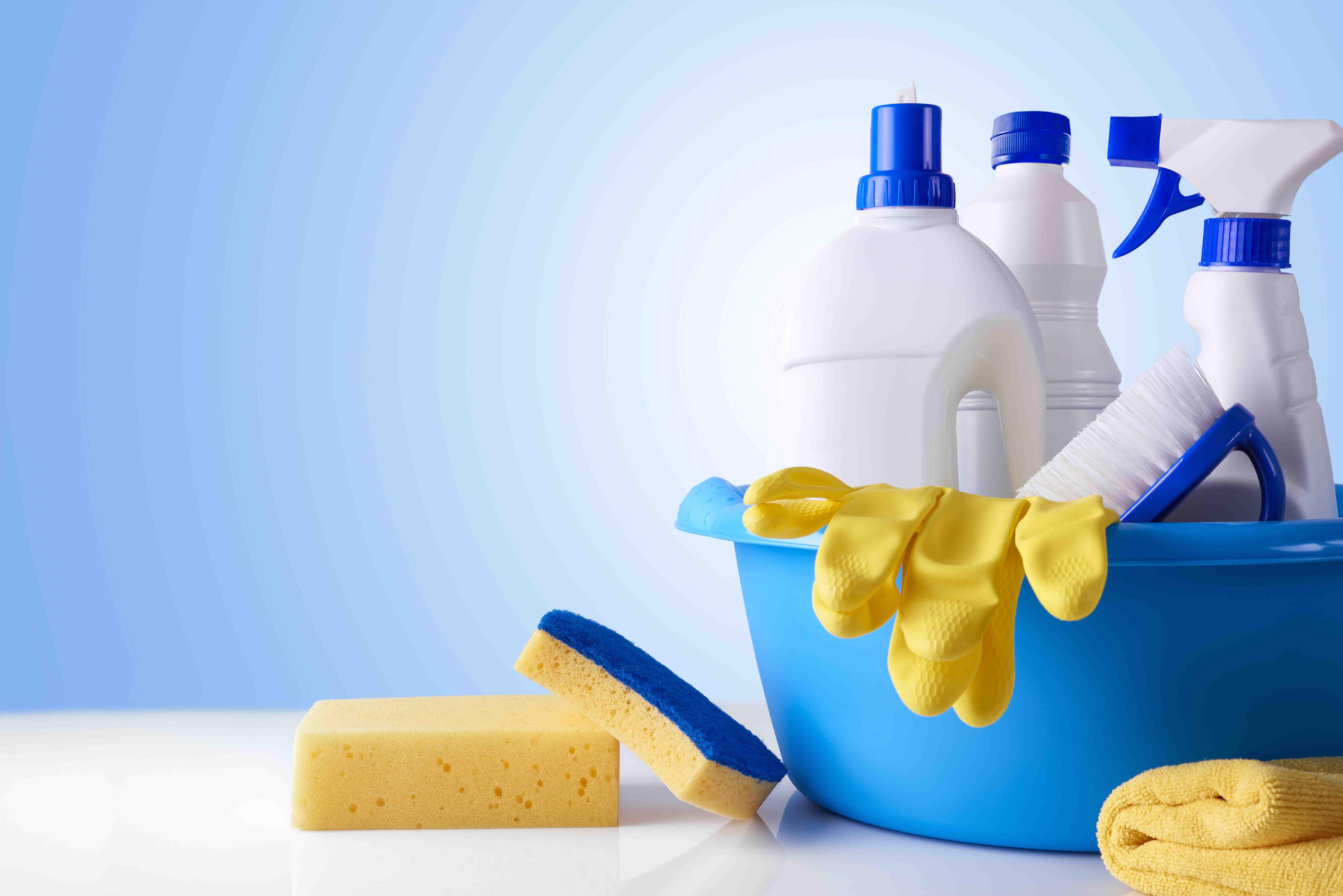Professional,Cleaning,Equipment,On,White,Table,And,Blue,Background,Overview.
